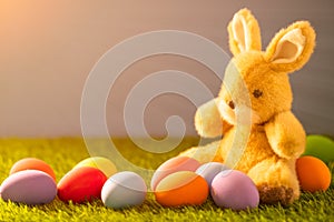 Easter eggs and rabbit on grass