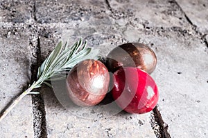 Easter eggs with rosemarry on stone background