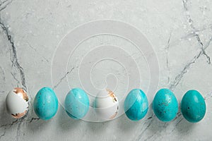 Easter eggs in a row. Cement background. Easter. Place for text