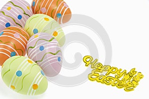 Easter eggs and sign on white background