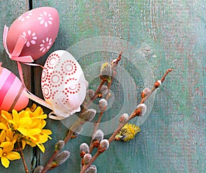 Easter eggs with spring decorations on a rustic background