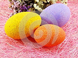Easter eggs with statice flower spring time background