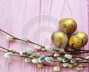 Easter eggs straw willow light tradition spring on a pink wooden present background