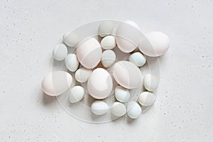 Easter eggs on the white table, tender light composition