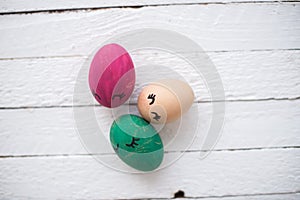 Easter eggs on a white wooden background