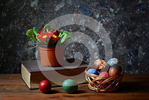 Easter eggs in wicker baskets and flowers