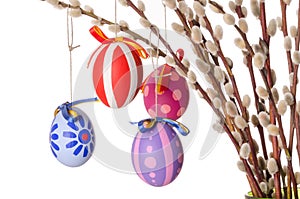 Easter eggs on willow bouquet with catkins, horizontal