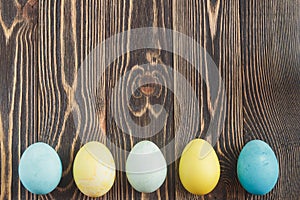 Easter eggs on wooden background with copyspace