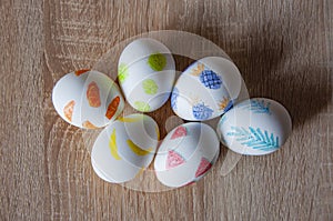 Easter eggs on wooden table. Happy Easter holiday celebration. Easter bunny hunt. Spring holiday at Sunday. Eastertide and