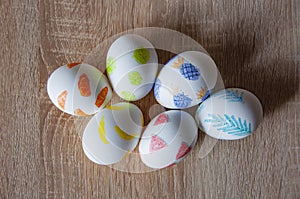 Easter eggs on wooden table. Happy Easter holiday celebration. Easter bunny hunt. Spring holiday at Sunday. Eastertide and photo