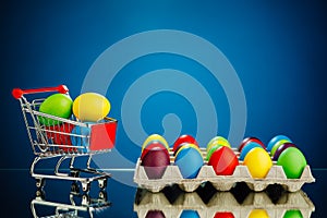 Easter festive multicolor eggs carton and shopping cart