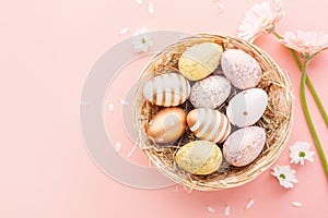 Easter Flat Lay of Eggs with flowers on pink