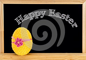 Easter frame with painted eggs and chalkboard. Happy Easter in white chalk