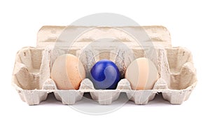 easter and fresh eggs on cardboard box