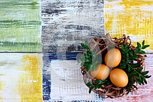 Easter fresh eggs in a nest made of rattan