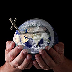 Easter gods hands holding world with cross