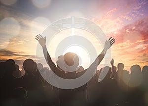 Easter and Good Friday concept, soft focus of Christian worship with raised hand on white cross background