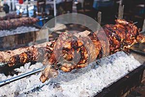 Easter in Greece, process of cooking traditional greek Easter dish - Souvla, grilled lamb, sheep and goat bbq, grilling over