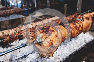 Easter in Greece, process of cooking traditional greek Easter dish - Souvla, grilled lamb, sheep and goat bbq, grilling over