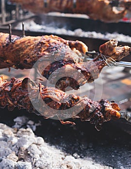 Easter in Greece, process of cooking traditional greek Easter dish - Souvla, grilled lamb, sheep and goat bbq, grilling over