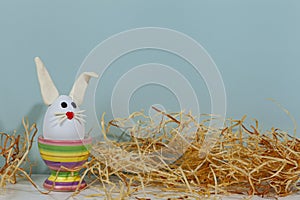 Easter greeting card. Easter egg with bunny ears on a stand