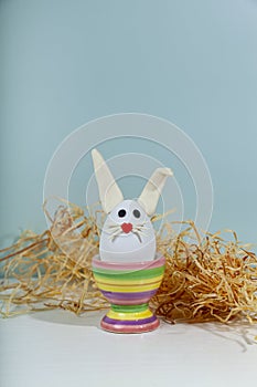 Easter greeting card. Easter egg with bunny ears on a stand