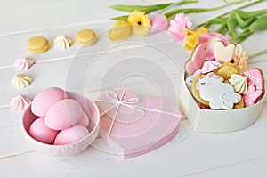 Easter greeting card with flowers, gingerbread cookies and eggs. Easter Postcard Template. Cookies in shape of eggs and Easter