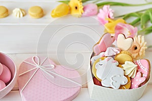 Easter greeting card with flowers, gingerbread cookies and eggs. Easter Postcard Template. Cookies in shape of eggs and Easter