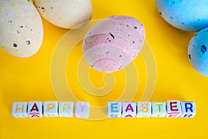 Easter greeting card with painted eggs. Seasonal Easter message Happy easter. Pastel and colorful decorated easter eggs