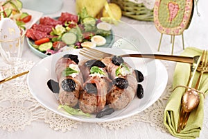 Easter grilled white sausage wrapped in bacon with prune and horseradish
