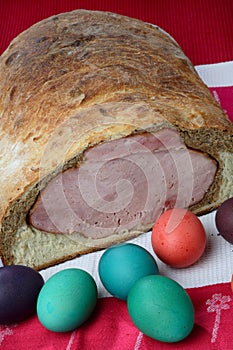 Easter ham on bread with colored eggs