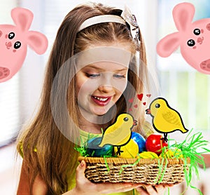 Easter happy girl child with bunny egg in nest.