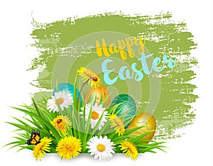 Easter Holiday Background with colofrul eggs in green grass and spring flowers.