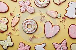 Easter holiday cookies background with gypsophila decorations. Pastel symbols of Easter food. Spring Easter card flat