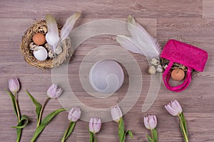 Easter holiday decoration design with eggs feathers bag tulips