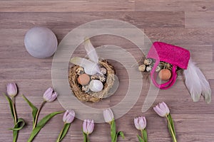 Easter holiday decoration design with eggs feathers bag tulips