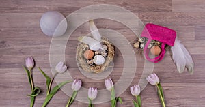 Easter holiday decoration panorama with eggs feathers bag tulips