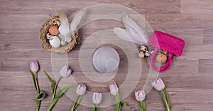 Easter holiday decoration panorama with eggs feathers bag tulips