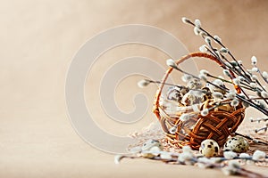 Easter holiday decoration. Quail eggs wrapped in hay in woven b