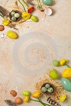 Easter holiday vertical border frame background with easter eggs and spring flowers.