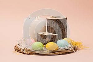 easter interior composition with painted eggs and candles in a natural style