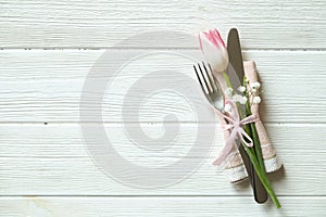 Easter laying table appointments, table setting options. Silverware, tableware items with festive decoration. Fork, knife and flow