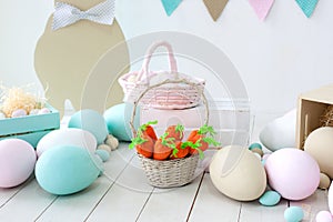 Easter! Many colorful Easter eggs with bunnies and baskets! Easter decoration of the room, children`s room for games. Basket with