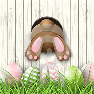 Easter motive, bunny bottom andeaster eggs in fresh grass on white wooden background, illustration