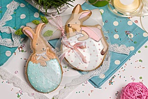 Easter multicolored rabbits egg honey-cake, grass, food photography