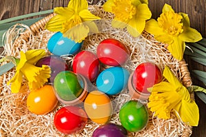 Easter nest with eggs and flowers