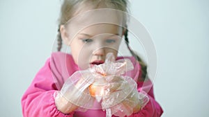 Easter, Passover, childhood, creativity, games concept - closeup of little cute blond three-year-old girl of Slovenian