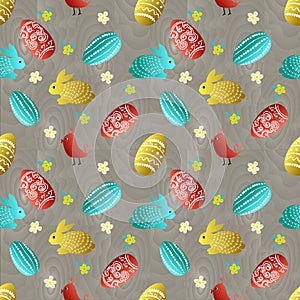 Easter pattern with rabbit, eggs and bird on wooden background photo