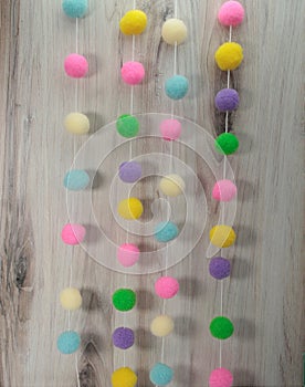 Easter pom poms on a string, pastel colors, curtain tiebacks, room dividers,