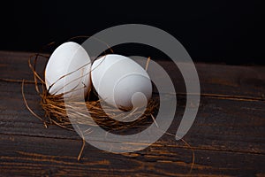 Easter poster and banner. bird nest and eggs on a wooden board